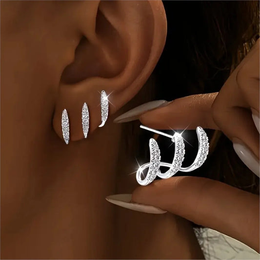 Conjunto de 2 brincos elegantes com strass e três garras para mulheres. Design luxuoso e delicado.